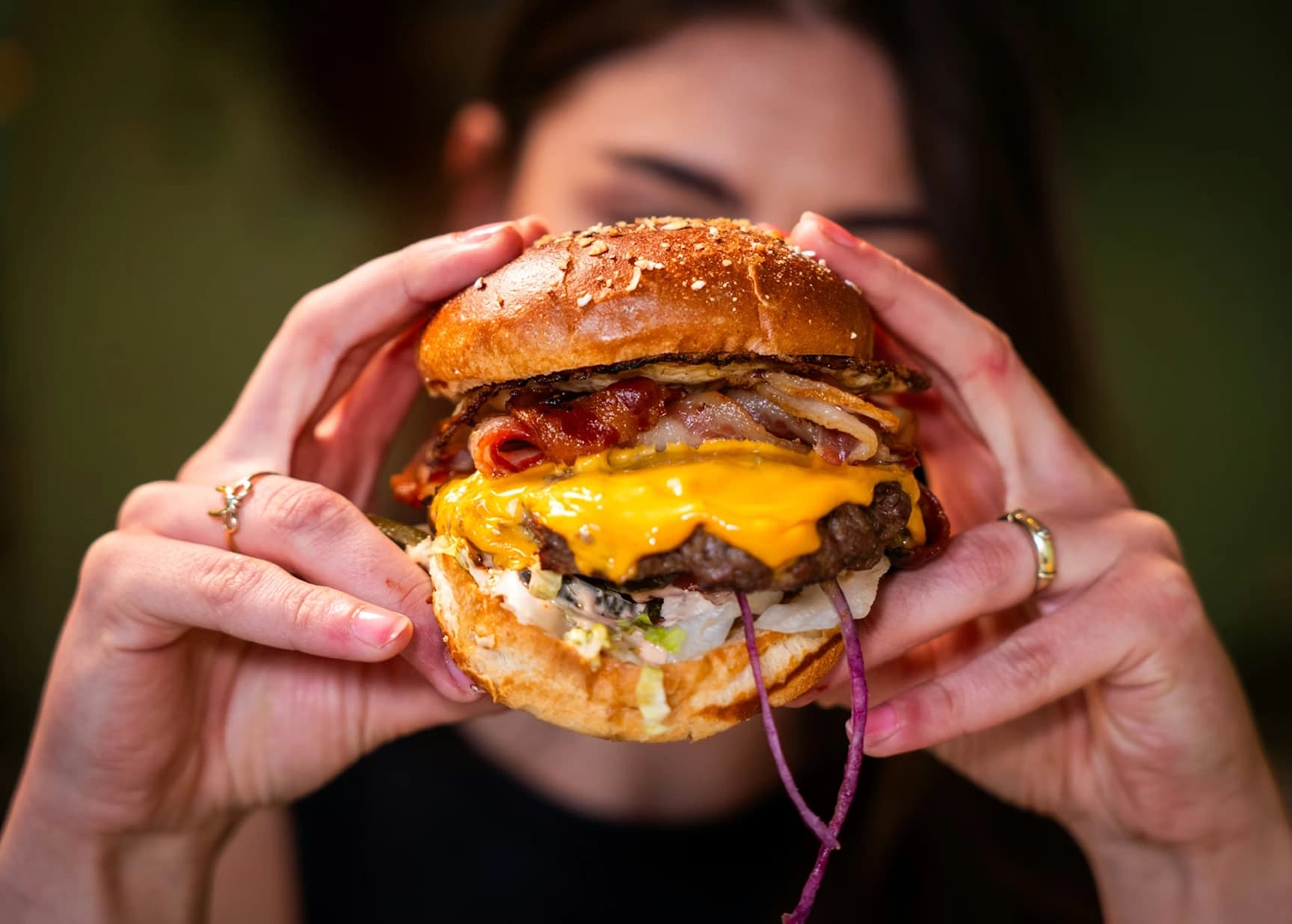 CRAV Signature Cheesy Burger with dripping cheese